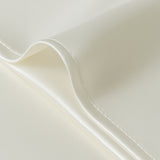 Model in white sleepwear holding a Jasmisilk 100% mulberry silk envelope pillowcase in ivory