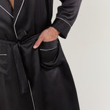 Close-up of pocket, waist tie, and cuff detail on Jasmisilk men's black pure silk robe