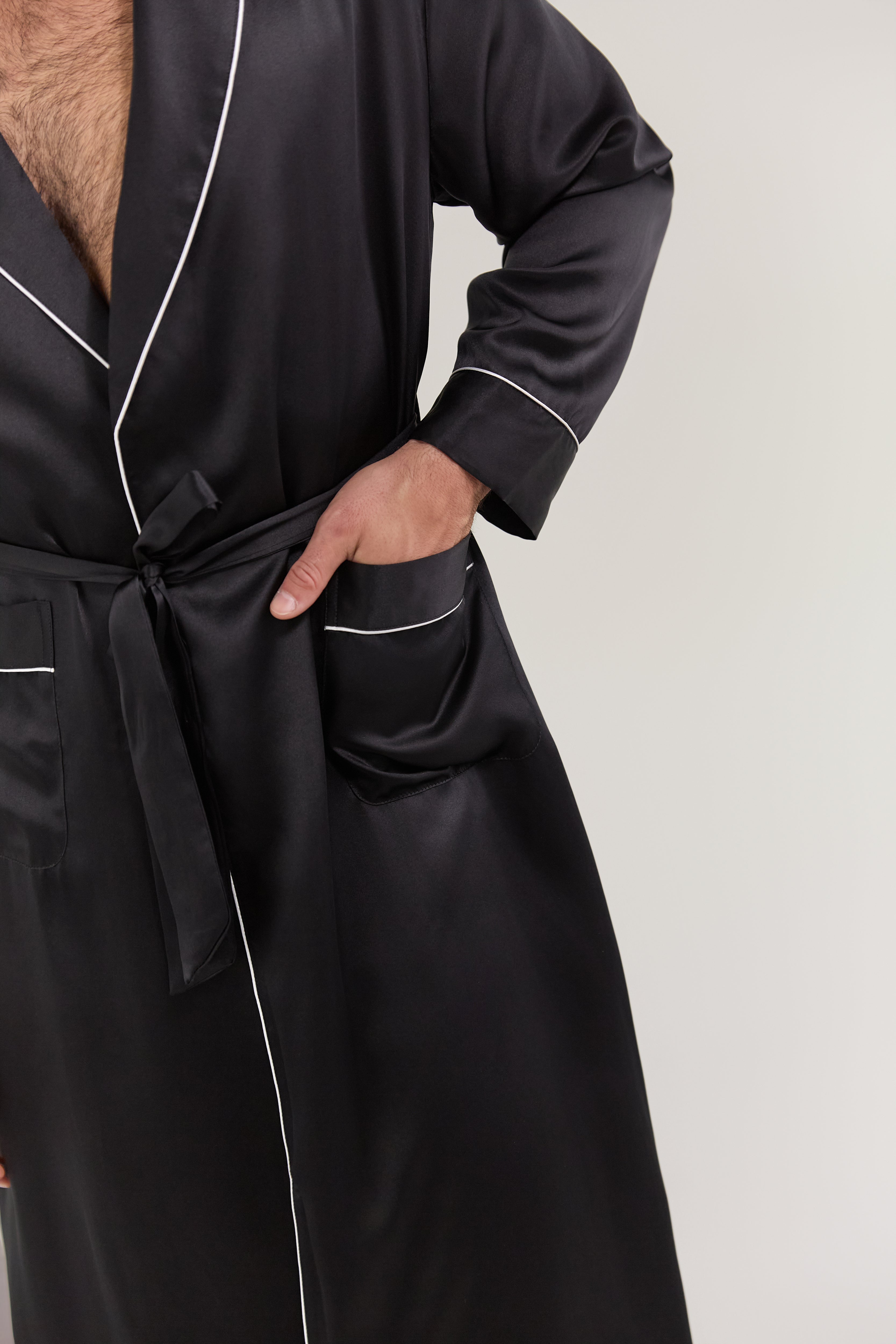 Close-up of pocket, waist tie, and cuff detail on Jasmisilk men's black pure silk robe