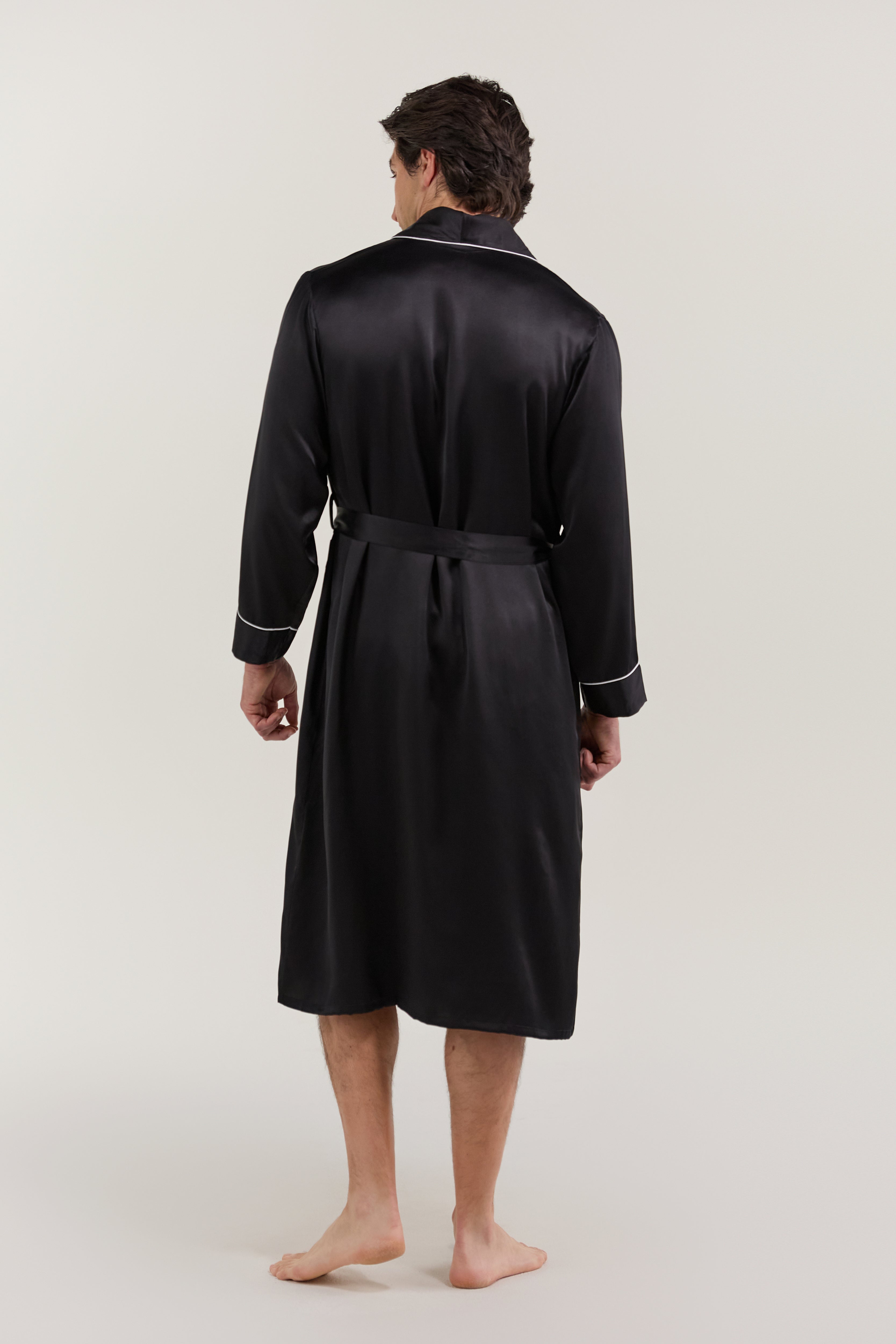 Back view of man wearing Jasmisilk men's black pure silk robe