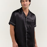 Close-up of man wearing Jasmisilk men's black short sleeve silk pajama