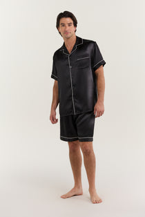 Man wearing Jasmisilk men's classic short sleeve black silk pajama set