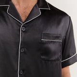 Close-up of collar, buttons, and chest pocket on Jasmisilk men's black silk pajama