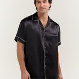 Close-up of man wearing Jasmisilk men's black short sleeve silk pajama